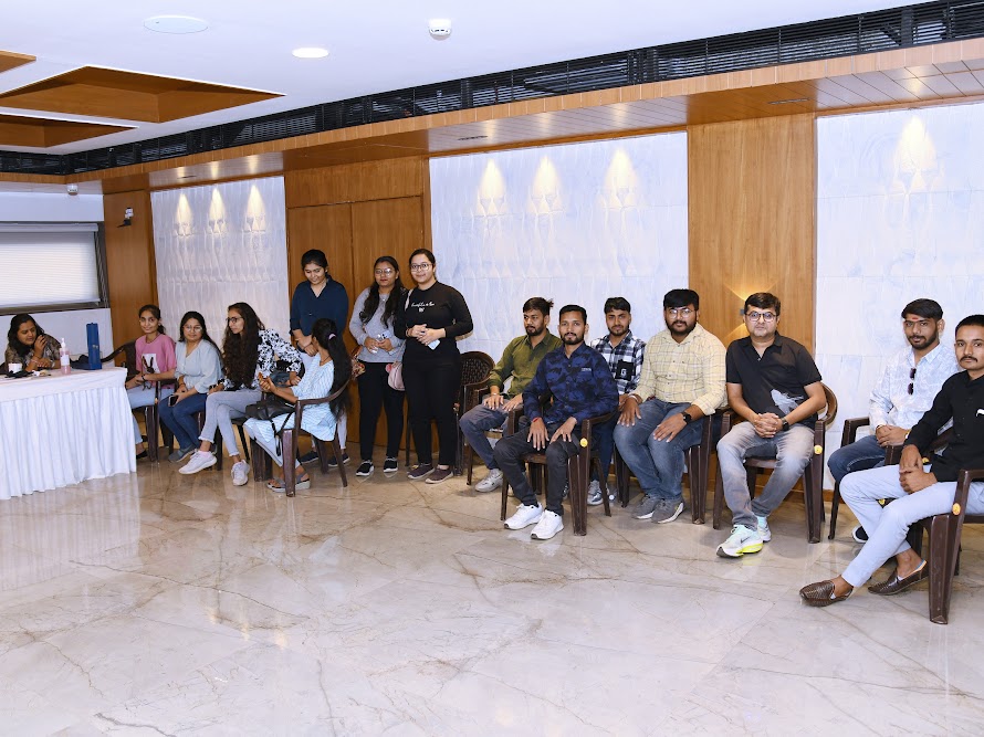 Health camp attendees seated inside the banquet hall
